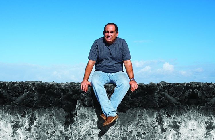 Alberto Pujols, a popular Cuban television actor, poses for a photo by artists Luidmila and Nelson, to be superimposed on a representation of Havana’s Malecon ocean drive produced using electron microscope images captured by Maria Dolores Durruty.