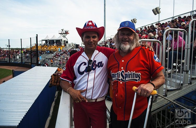 Two fans wearing Cuban baseball shirts.