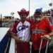 Two fans wearing Cuban baseball shirts.