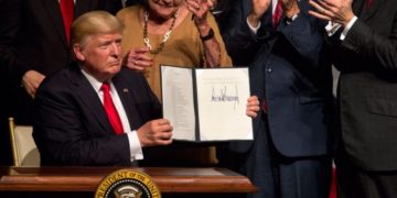 Donald Trump shows the presidential memorandum on the Cuba policy at the end of his speech at the Manuel Artime Theater of Little Havana, in Miami. Photo: Cristobal Herrera / EFE.