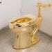 The 18-karat toilet titled “United States” is a criticism by Maurizio Cattelan of the nation’s greedy instincts.