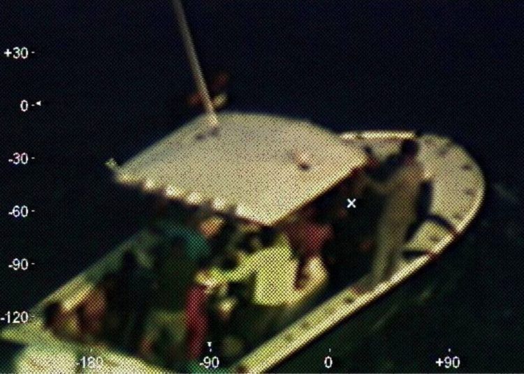 This photograph provided by the U.S. Coast Guard, captured by an airplane of that agency, shows a broken down boat located 210 kilometers (130 nautical miles) from the Yucatan Peninsula in Mexico, on Sunday, April 14, 2019. Photo: Third Class Petty Officer Brandon Giles/ U.S. Coast Guard via AP.