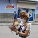 Two people walk wearing facemasks in Havana, as protection against the coronavirus pandemic. Photo: Otmaro Rodríguez.