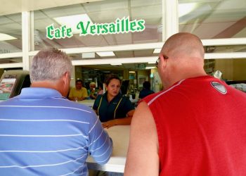 Two clients have coffee at the Versailles window in Little Havana. Photo: Rui Ferreira.