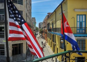 Cuban and U.S. flags on the facade of the La Moneda Cubana Restaurant in Havana. Photo: Yamil Lage/AFP/Getty Images.