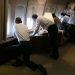 President Obama and members of his team look out the windows of Air Force One during the landing in Cuba. Photo: Pete Souza/The White House