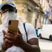 A man checks the internet on his cell phone in Havana, during the COVID-19 pandemic. Photo: Otmaro Rodríguez/OnCuba Archive.