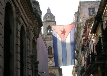 Cuban flag hanging in Havana. churches