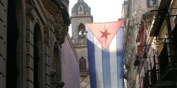 Cuban flag hanging in Havana. churches