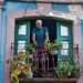 Man on a balcony in Havana. Dollar in Cuba