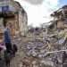 A 49-year-old man, Genadi, shows his neighbors’ destroyed building in Cherkaski Tyshky, Kharkiv region, Ukraine, on March 27, 2023. The Ukrainian army drove Russian forces out of the occupied territory in the northeast of the country in counterattacks in the autumn of 2022. Kharkiv and its surroundings areas have been subjected to intense bombing since February 2022. Photo: EFE/EPA/SERGEY KOZLOV.