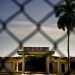 A building with the legend “República de Cuba. Territorio Libre de América,” behind a fence that marks the border with the United States Naval Base in Guantanamo Bay. Photo: Ramón Espinosa/AP.