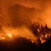 Smoke and flames rise from the burning forest in Bitsch, Switzerland. Photo: EFE/JEAN-CHRISTOPHE BOTT.