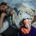 A pilgrim takes a nap next to an image of old San Lázaro. Photo: Alejandro Ernesto.