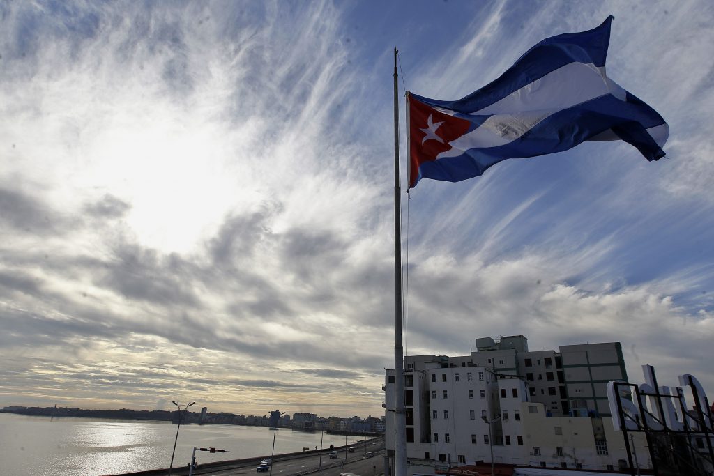 The Cuban flag is flying at half mast today in homage to the victims of yesterday’s plane accident in which 108 persons died. Photo: Ernesto Mastrascusa / EFE.