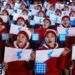Integrantes de la delegación norcoreana portan banderas del equipo coreano unido en los Juegos Olímpicos de Invierno en Pyeongchang, Corea del Sur. Foto: Natacha Pisarenko / AP.