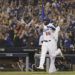 Yasiel Puig festeja tras batear un jonrón ante Boston en el cuarto juego de la Serie Mundial. (AP Foto/David J. Phillip)