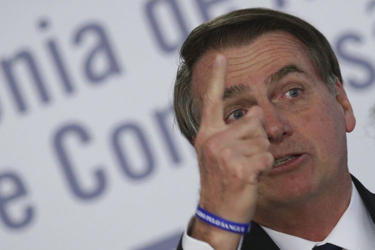 El persidente Jair Bolsonaro habla durante una ceremonia en el palacio presidencial de Planalto en Brasilia, Brasil, el lunes 25 de marzo de 2019. Foto: Eraldo Peres / AP.