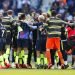 Jugadores del Manchester City festejan al final de la victoria sobre Brighton que les aseguró el título de la Liga Premier inglesa, en el Estadio AMEX de Brighton, Inglaterra, el domingo 12 de mayo de 2019. (AP Foto/Frank Augstein)