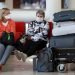 Personas esperan la salida de sus vuelos antes del cierre parcial de las fronteras cubanas para evitar la propagación de la COVID-19, en el Aeropuerto Internacional "José Martí" de La Habana, el 23 de marzo de 2020. Foto: Yander Zamora / EFE.