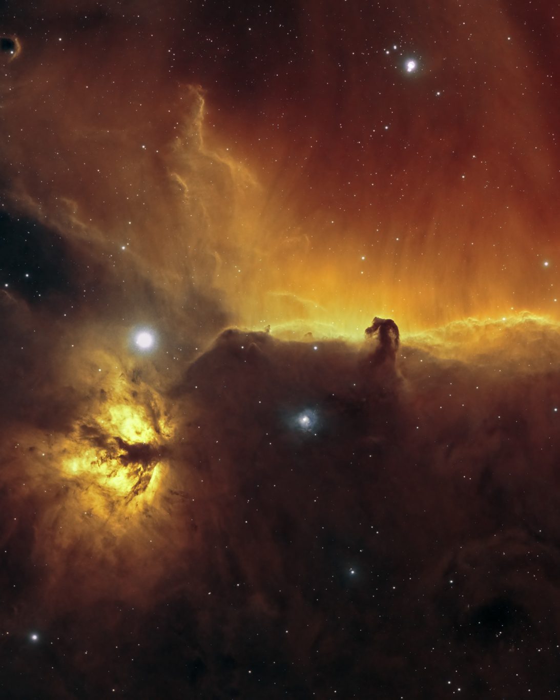 Nebulosas Flama y Cabeza de Caballo: una región de hidrógeno ionizado rodeada de densas nubes oscuras de polvo y gas. Foto: Franco Meconi.